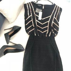 Black and Gold BeBe Dress, both Sheek yet Sexy.